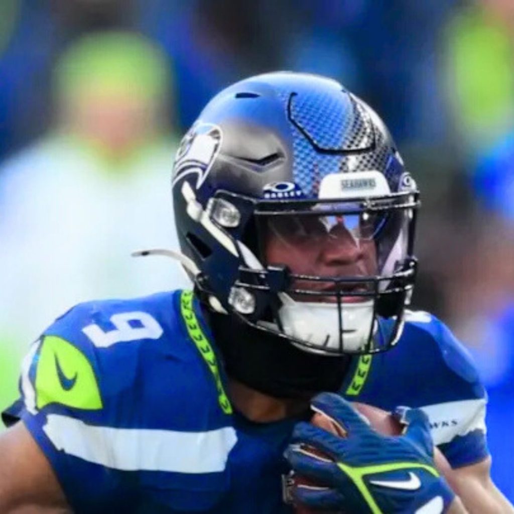 Kenneth Walker III running with the ball during Super Bowl 2026, earning Super Bowl MVP honors